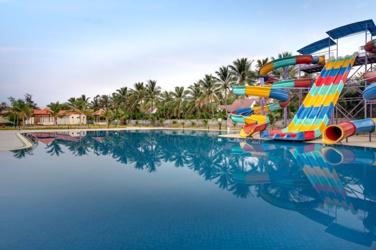 sonnenpark willingen - Colorful water slides and a serene pool at a summer water park for relaxation
